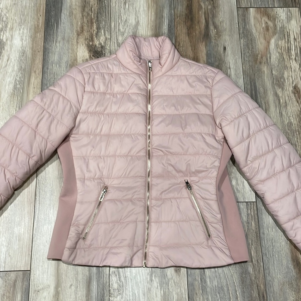 Light pink bomber jacket with gold decals. Size medium.